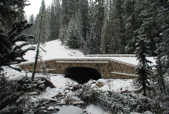 A culvert over a stream made from MULTI-PLATE.