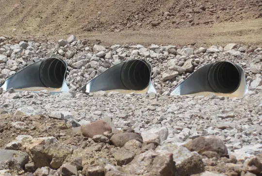 A culvert made from ULTRA FLOW corrugated metal pipe.